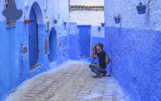 Solo travel in Morocco passing through the blue gates of Chefchaouen