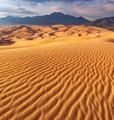 Best Time to Visit Morocco illustrated by desert dunes, mountains, and historic cities